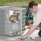 Who drags a condenser unit out to the driveway for repairs? That guy right there.